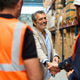 Manager and warehouse worker shaking hands on a deal Manager and warehouse worker shaking hands on a deal - PhotoDune Item for Sale