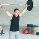 Fit_man_doing_barbell_jerk Fit_man_doing_barbell_jerk - PhotoDune Item for Sale