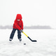 Child Playing Hockey on a Frozen Lake During Winter Child Playing Hockey on a Frozen Lake During Winter - PhotoDune Item for Sale