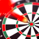 Red dart hitting the bullseye on a dartboard with black and white segments Red dart hitting the bullseye on a dartboard with black and white segments - PhotoDune Item for Sale