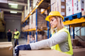 Female warehouse worker loading boxes. Female warehouse worker loading boxes. - PhotoDune Item for Sale