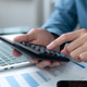 Businessman hands using a calculator to check company finances and earnings and budget. Businessman hands using a calculator to check company finances and earnings and budget. - PhotoDune Item for Sale
