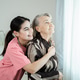 Female caregiver or nurse holding hand senior grandmother give support empathy. Female caregiver or nurse holding hand senior grandmother give support empathy. - PhotoDune Item for Sale