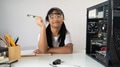 Adorable school girl learning to fix a computer hardware that putting on white working desk. Adorable school girl learning to fix a computer hardware that putting on white working desk. - PhotoDune Item for Sale