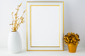Frame mockup with white vase and golden flower pot Frame mockup with white vase and golden flower pot - PhotoDune Item for Sale