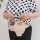 An elderly woman with a colostomy bag on her stomach. An elderly woman with a colostomy bag on her stomach. - PhotoDune Item for Sale