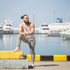 Athletic crossfit instructor relaxing after hard workout outdoors. Athletic crossfit instructor relaxing after hard workout outdoors. - PhotoDune Item for Sale