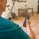 Older woman unrecognisable using TV remote control Older woman unrecognisable using TV remote control - PhotoDune Item for Sale