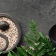 Yin Yang Zen Garden with Candle and Fern on Dark Stone Background Yin Yang Zen Garden with Candle and Fern on Dark Stone Background - PhotoDune Item for Sale