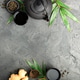 Asian Tea Set with Ginger and Green Leaves on Dark Stone Background Asian Tea Set with Ginger and Green Leaves on Dark Stone Background - PhotoDune Item for Sale