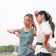 Asian woman checking time on wristwatch aside a friend wiping sweat after exercise in sports stadium Asian woman checking time on wristwatch aside a friend wiping sweat after exercise in sports stadium - PhotoDune Item for Sale