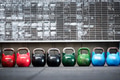 Row of colorful pairs of kettlebell weights Row of colorful pairs of kettlebell weights - PhotoDune Item for Sale