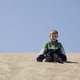 Child Enjoying a Sunny Day on Desert Dunes Child Enjoying a Sunny Day on Desert Dunes - PhotoDune Item for Sale