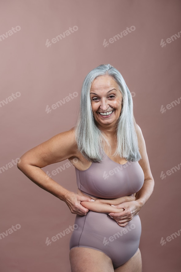 Portrait of senior woman in lingerie, studio shoot. Stock Photo by halfpoint Portrait of senior woman in lingerie, studio shoot. Stock Photo by halfpoint
