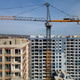 Aerial View of High-Rise Residential Construction Site with Tower Crane Aerial View of High-Rise Residential Construction Site with Tower Crane - PhotoDune Item for Sale
