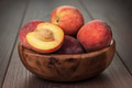 Wooden Bowl With Some Peaches On The Table Wooden Bowl With Some Peaches On The Table - PhotoDune Item for Sale