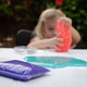 Defocused blonde caucasian girl with playing with slime at desk. Child sensory development Defocused blonde caucasian girl with playing with slime at desk. Child sensory development - PhotoDune Item for Sale
