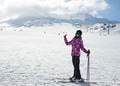 A teenager girl in a ski suit, a helmet and a sun mask stands on skis and with ski poles A teenager girl in a ski suit, a helmet and a sun mask stands on skis and with ski poles - PhotoDune Item for Sale