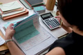 Adult asian woman working on payment bills accounting summary da Adult asian woman working on payment bills accounting summary da - PhotoDune Item for Sale
