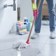 Woman cleaning up the floor with a mop Woman cleaning up the floor with a mop - PhotoDune Item for Sale