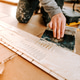 Worker laying and gluing parquet flooring Worker laying and gluing parquet flooring - PhotoDune Item for Sale