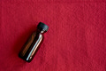 Mock-up amber glass bottle on a red background Mock-up amber glass bottle on a red background - PhotoDune Item for Sale