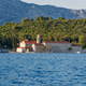 Beautiful stone monastery on Badija island near Korcula on a sunny summer day Beautiful stone monastery on Badija island near Korcula on a sunny summer day - PhotoDune Item for Sale