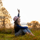 beautiful girl is resting grass. bright sunset. village. field. Trees, Autumn. Fall. landscape. beautiful girl is resting grass. bright sunset. village. field. Trees, Autumn. Fall. landscape. - PhotoDune Item for Sale
