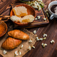 Blooming tree flowers and honeycomb with croissants and a cup of coffee on a wooden table Blooming tree flowers and honeycomb with croissants and a cup of coffee on a wooden table - PhotoDune Item for Sale