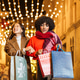 Diverse women friends enjoying christmas shopping at night Diverse women friends enjoying christmas shopping at night - PhotoDune Item for Sale