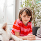 A teenage girl reads a book on the floor in her room next to her dog, a white Swiss shepherd A teenage girl reads a book on the floor in her room next to her dog, a white Swiss shepherd - PhotoDune Item for Sale
