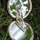 Artistic Silver Pendant on Vintage Mirror in Nature, Reflecting Greenery and Outdoor Beauty. Artistic Silver Pendant on Vintage Mirror in Nature, Reflecting Greenery and Outdoor Beauty. - PhotoDune Item for Sale