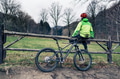 Mountain biker cycling on trail in woods Mountain biker cycling on trail in woods - PhotoDune Item for Sale