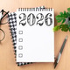 New year resolutions 2026 on desk. 2026 resolutions list with notebook, coffee cup on table New year resolutions 2026 on desk. 2026 resolutions list with notebook, coffee cup on table - PhotoDune Item for Sale