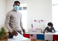 African-american man putting his vote in the ballot box, usa elections and coronavirus African-american man putting his vote in the ballot box, usa elections and coronavirus - PhotoDune Item for Sale