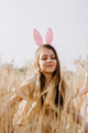 Teen girl in wheat field with easter bunny ears Teen girl in wheat field with easter bunny ears - PhotoDune Item for Sale