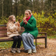 Sitting mother with daughter on park bench. Family talk, smile supports love, care, trust. Outdoor Sitting mother with daughter on park bench. Family talk, smile supports love, care, trust. Outdoor - PhotoDune Item for Sale