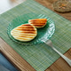 Fried round slices of cheese served on plate on wooden table Fried round slices of cheese served on plate on wooden table - PhotoDune Item for Sale