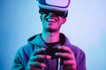 Young gamer playing to new video games with virtual reality experience Young gamer playing to new video games with virtual reality experience - PhotoDune Item for Sale