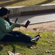 woman in the square taking a photo with her phone of the book cover woman in the square taking a photo with her phone of the book cover - PhotoDune Item for Sale