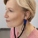 Audiologist setting a hearing aid for a client, ensuring optimal performance and comfort Audiologist setting a hearing aid for a client, ensuring optimal performance and comfort - PhotoDune Item for Sale