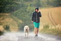 Man with dog in heavy rain Man with dog in heavy rain - PhotoDune Item for Sale