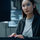 Asian female software developer typing code at computer in modern office. Asian female software developer typing code at computer in modern office. - PhotoDune Item for Sale
