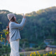 Portrait image of a woman taking photo of a beautiful nature in the park Portrait image of a woman taking photo of a beautiful nature in the park - PhotoDune Item for Sale