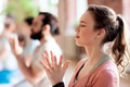 woman with group meditating at yoga studio woman with group meditating at yoga studio - PhotoDune Item for Sale