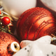 Close-up of Christmas tree decorations. Red balloons and baubles Close-up of Christmas tree decorations. Red balloons and baubles - PhotoDune Item for Sale