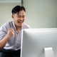Asian businessman or office worker looking at computer and making a fist in excited at working table Asian businessman or office worker looking at computer and making a fist in excited at working table - PhotoDune Item for Sale