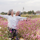Happy Asian Senior Women Enjoying Freedom in Pink Flower Field Happy Asian Senior Women Enjoying Freedom in Pink Flower Field - PhotoDune Item for Sale