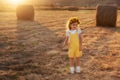 Happy girl child in yellow dress runs in autumn field Happy girl child in yellow dress runs in autumn field - PhotoDune Item for Sale