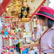 thai woman shopping for souvenirs at wat arun temple in bangkok thailand thai woman shopping for souvenirs at wat arun temple in bangkok thailand - PhotoDune Item for Sale